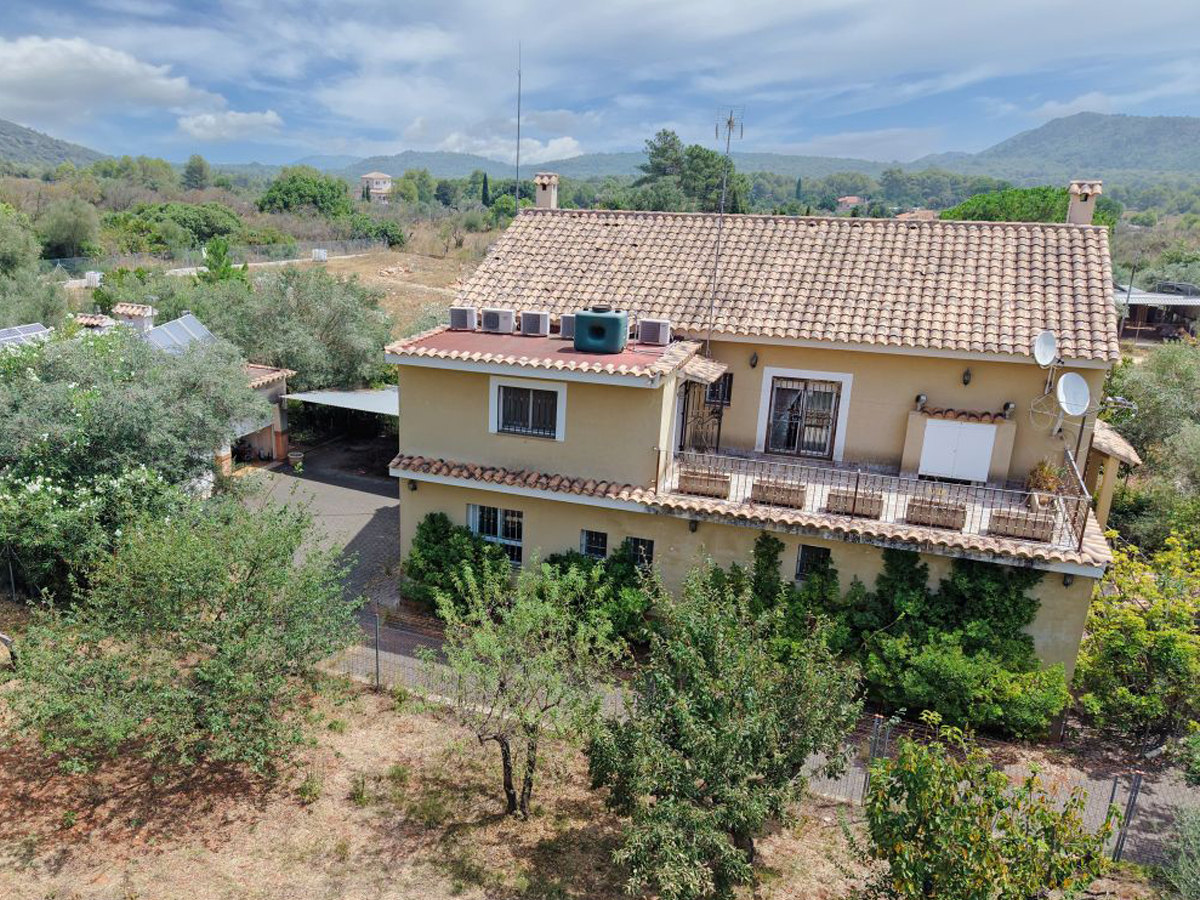 A beautifully constructed house in a peaceful country setting.