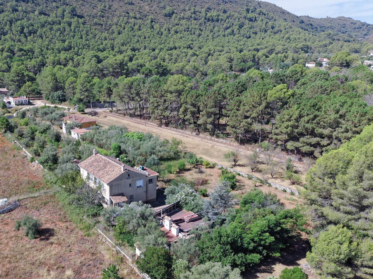 A beautifully constructed house in a peaceful country setting.