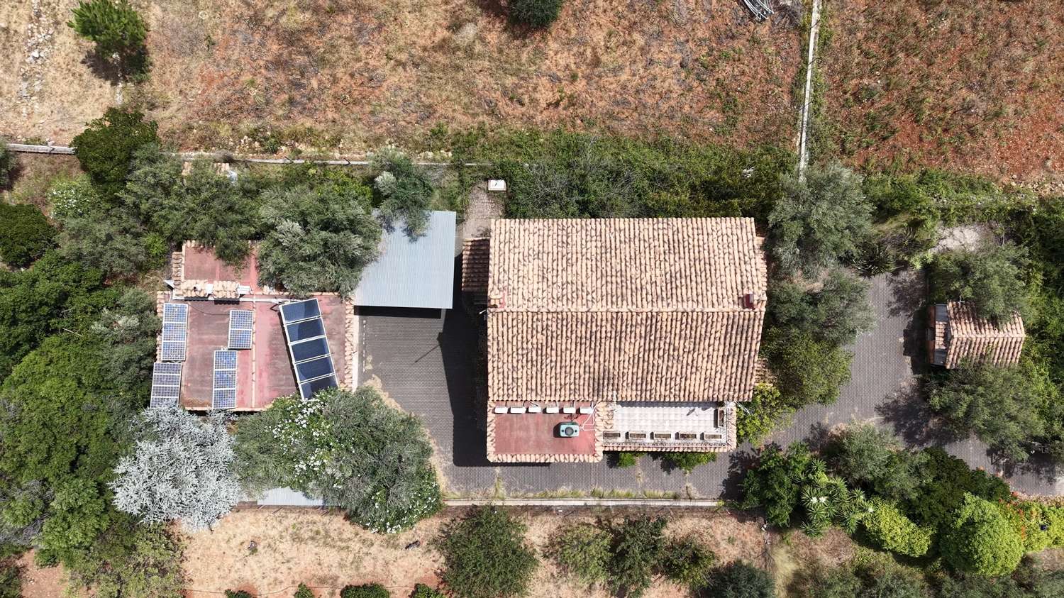 A beautifully constructed house in a peaceful country setting.