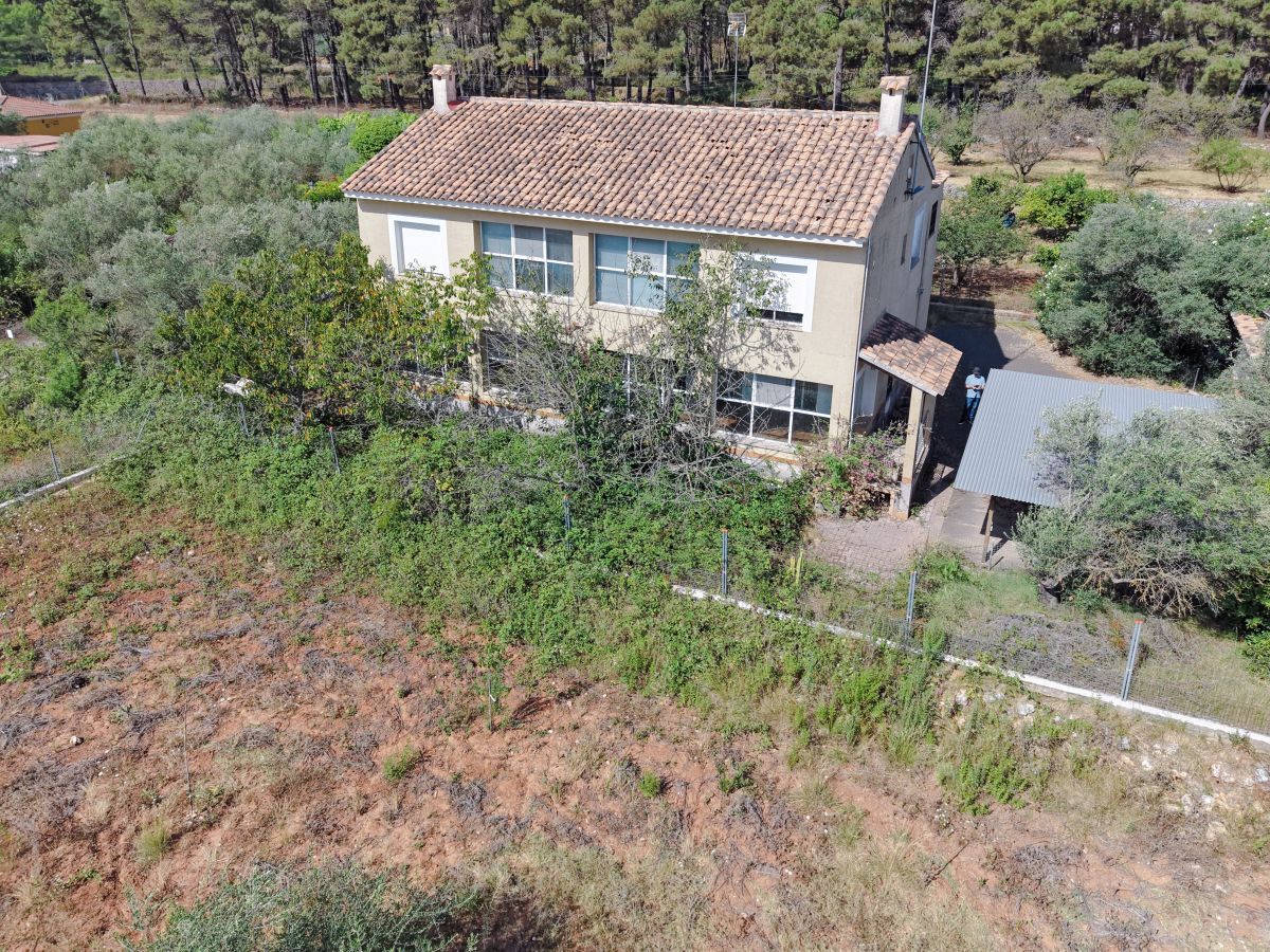 A beautifully constructed house in a peaceful country setting.