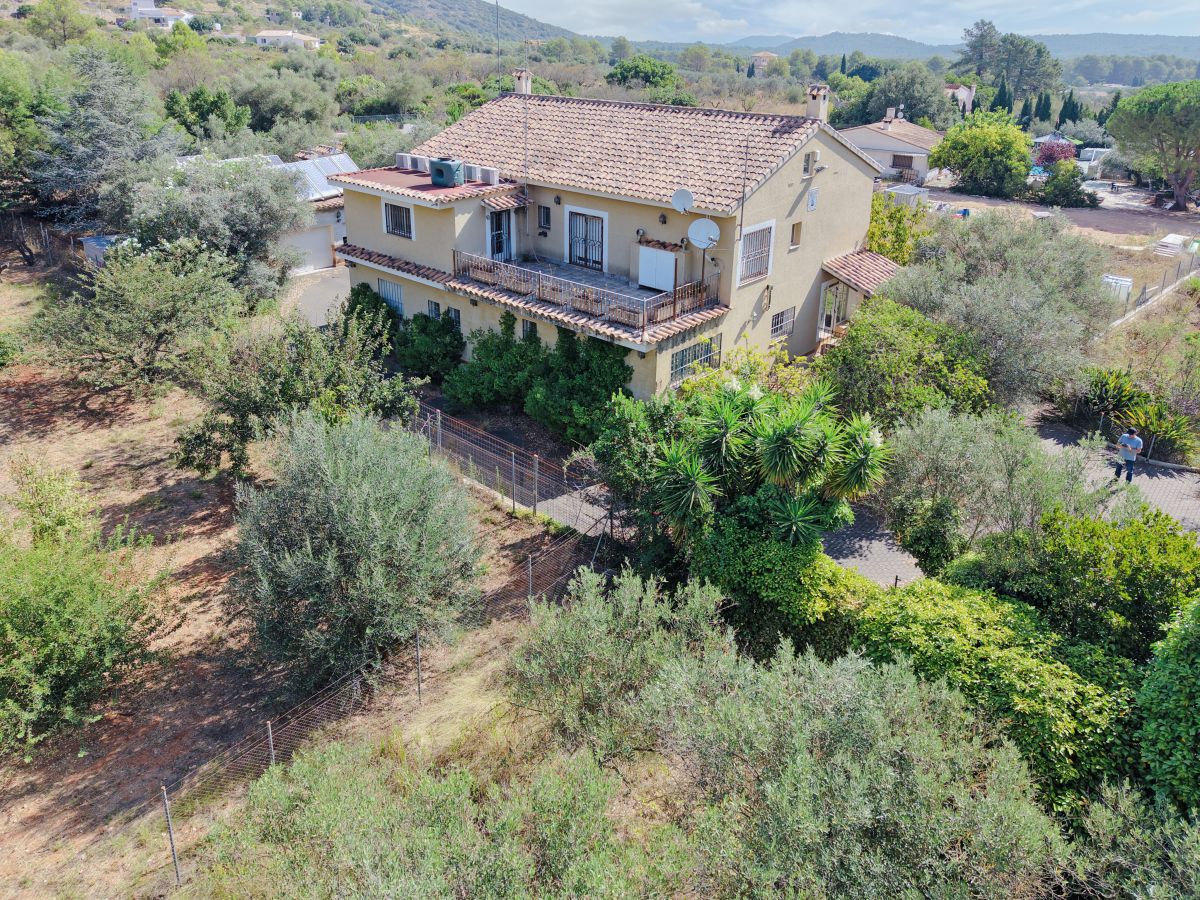 A beautifully constructed house in a peaceful country setting.