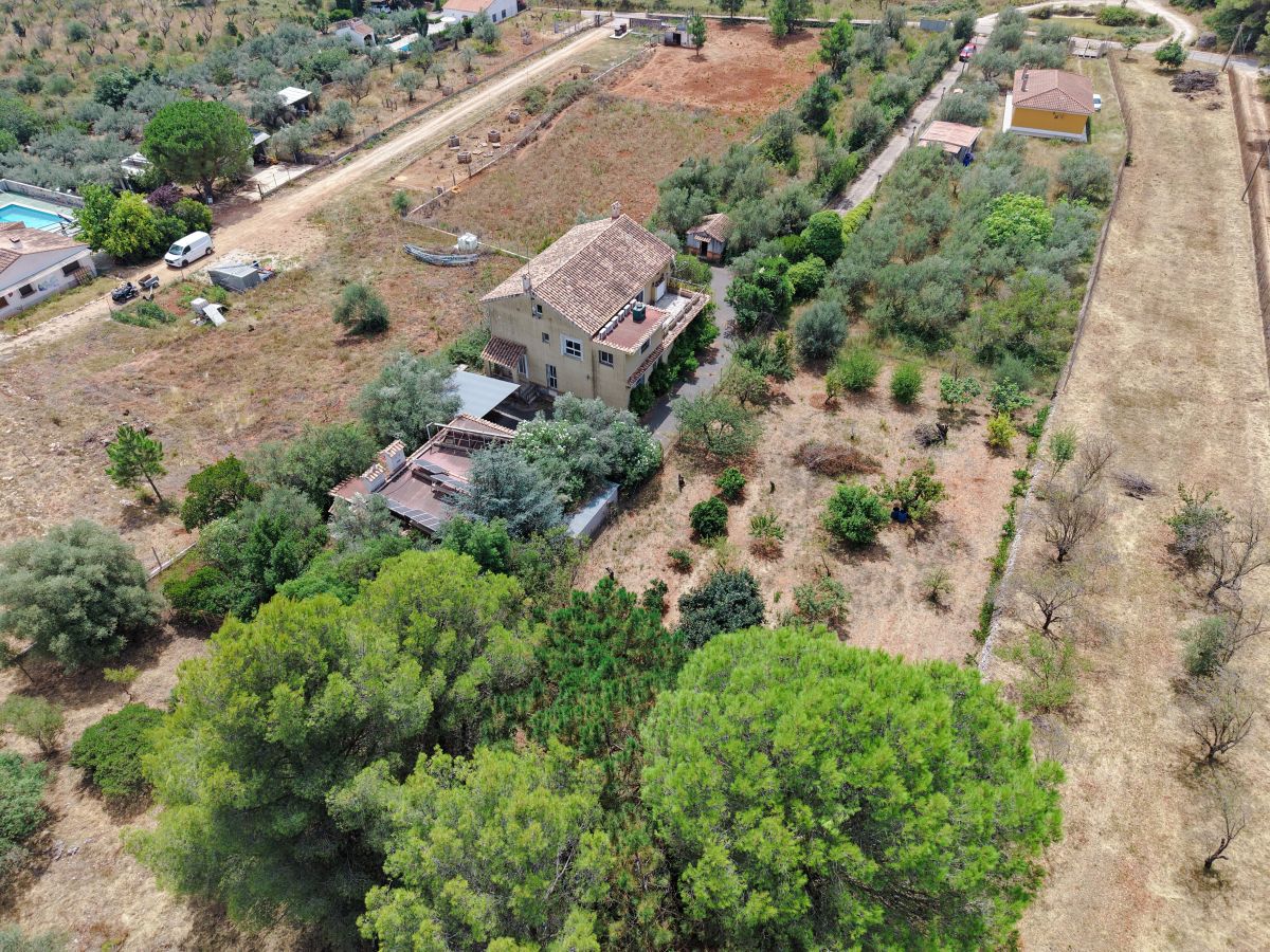 A beautifully constructed house in a peaceful country setting.